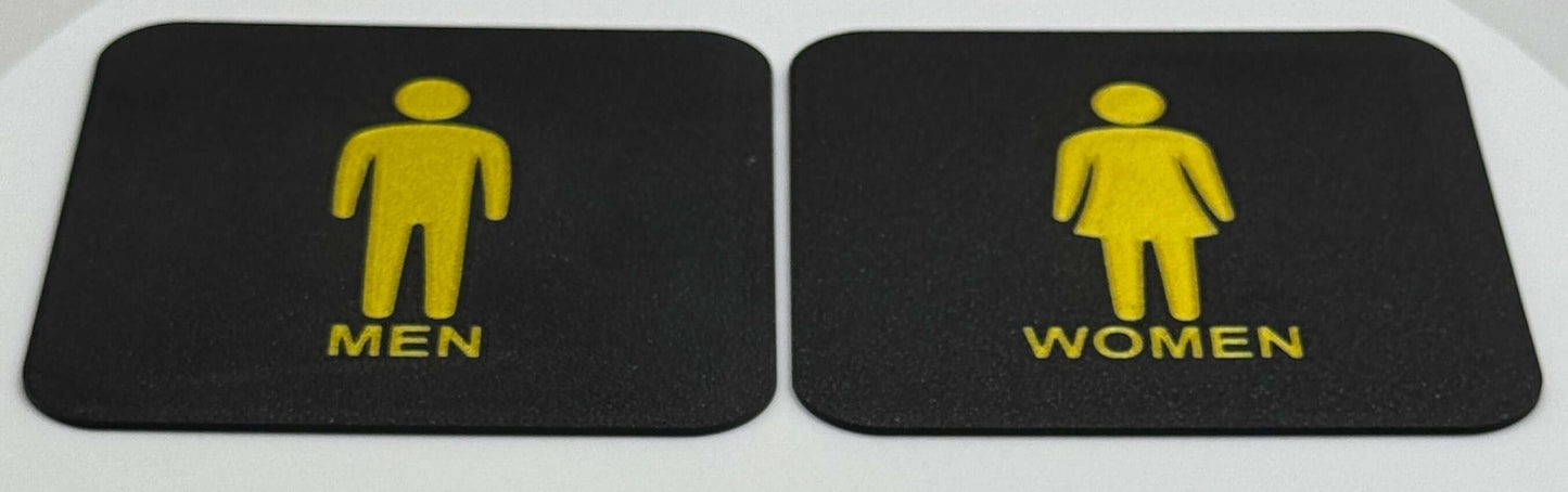 Toilet bordjes / WC bordjes met een man en een vrouw erop. schuine aanzicht