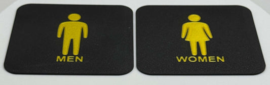 Toilet bordjes / WC bordjes met een man en een vrouw erop. schuine aanzicht