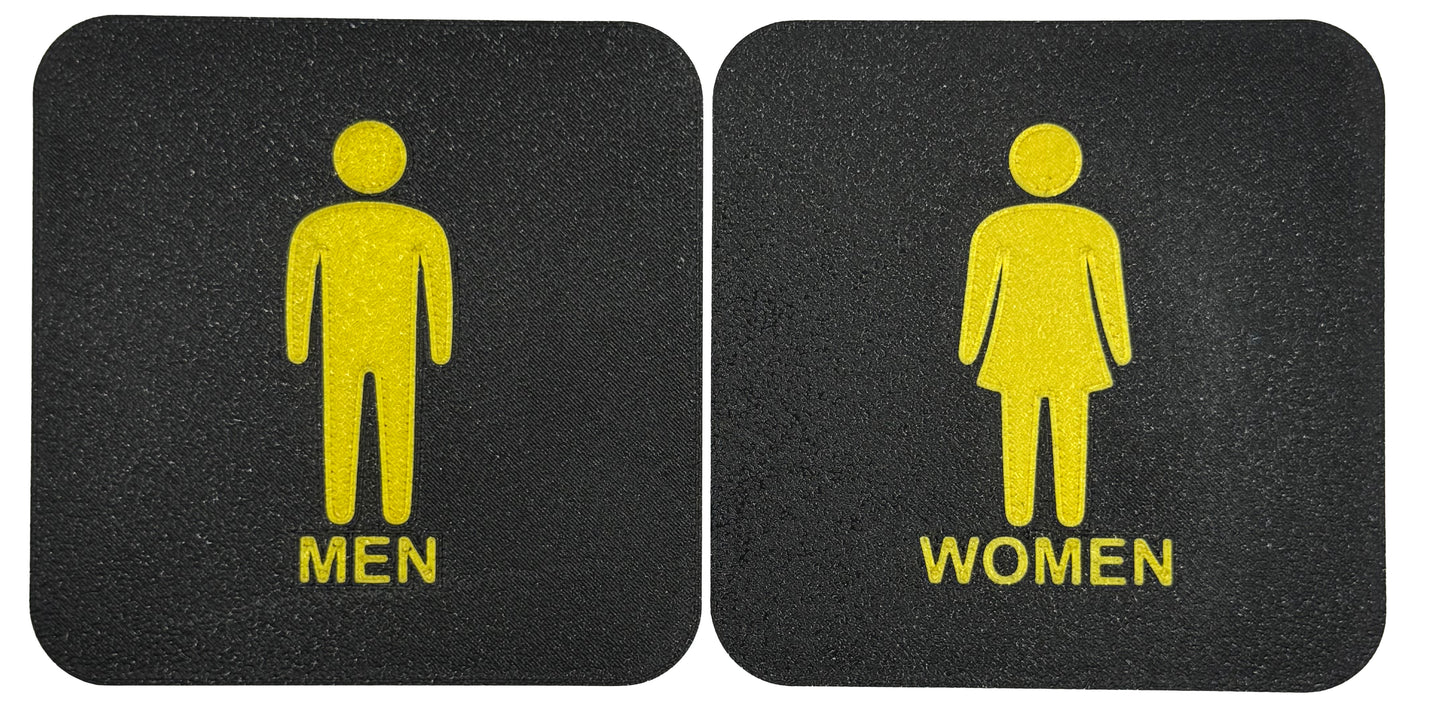 Toilet / WC bordjes met een man en een vrouw erop.