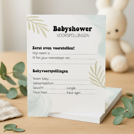 Babyshower invulkaart met eucalyptus-ontwerp op houten tafel met eucalyptustakjes en gebreid knuffelkonijn